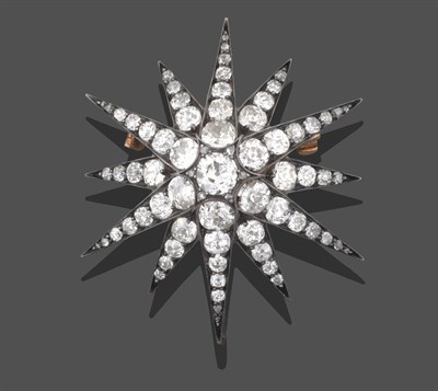 Lot 2206 - A Victorian Diamond Star Brooch/Pendant, the central raised old cut diamond with rose cut...