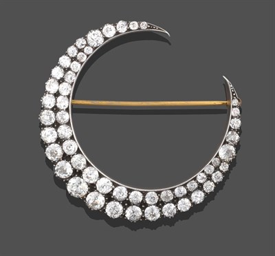 Lot 2212 - A Victorian Diamond Crescent Brooch, two rows of graduated old cut diamonds, in white collet...