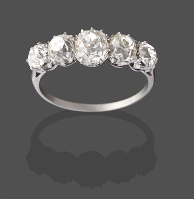 Lot 2218 - A Diamond Five Stone Ring, the graduated old cut diamonds in white claw settings, to a tapered...