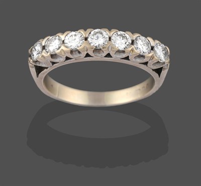 Lot 2226 - A Diamond Seven Stone Ring, the round brilliant cut diamonds in white claw settings, to a...