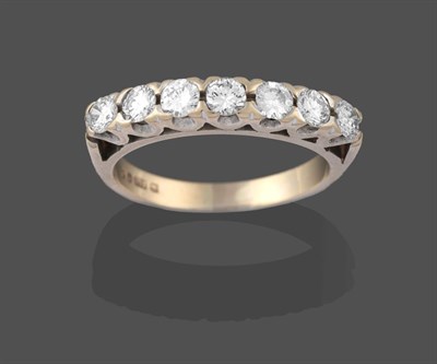 Lot 2228 - A Diamond Seven Stone Ring, the round brilliant cut diamonds in white claw settings, to a...