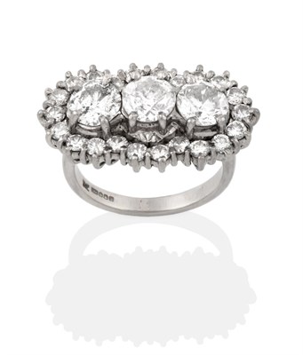 Lot 2242A - An 18 Carat White Gold Diamond Triple Cluster Ring, three round brilliant cut diamonds within a...