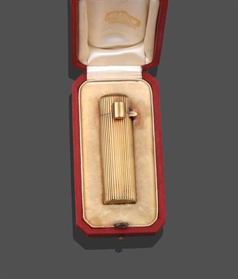Lot 2249 - An 18 Carat Gold Lipstick Case, by Cartier, circa 1945, of cylindrical form with reeded decoration
