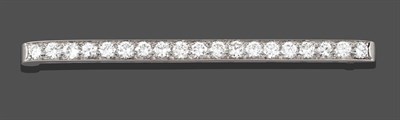 Lot 2257 - A Diamond Bar Brooch, by Tiffany & Co., the nineteen round brilliant cut diamonds in white claw and