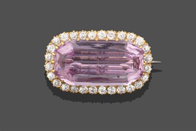 Lot 2258 - A Pink Tourmaline and Diamond Brooch, the emerald-cut pink tourmaline within a border of old...