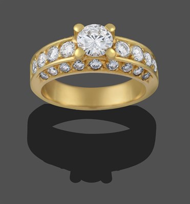 Lot 2263 - A Diamond Solitaire Ring, the round brilliant cut diamond in a yellow claw setting, to round...