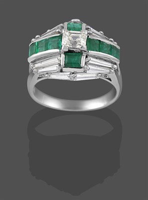 Lot 2275 - An Emerald and Diamond Cluster Ring, a cross motif formed of calibré cut emeralds with a...