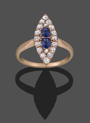 Lot 2281 - A Sapphire and Diamond Navette Ring, two oval cut sapphires within a border of rose cut and old cut