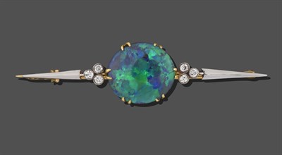Lot 2284 - A Black Opal and Diamond Bar Brooch, the circular black opal in a yellow double claw setting,...