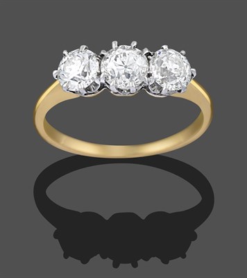 Lot 2292 - A Diamond Three Stone Ring, the old cut diamonds in white claw settings, to a yellow tapered...