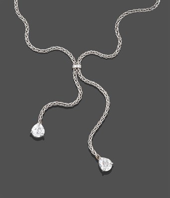 Lot 2298 - A Platinum Diamond Negligée Necklace, the foxtail link chain gathered by a round brilliant cut...