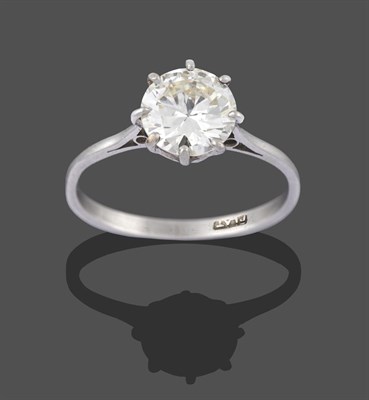 Lot 2299 - A Diamond Solitaire Ring, the round brilliant cut diamond in a white claw setting, to a tapered...