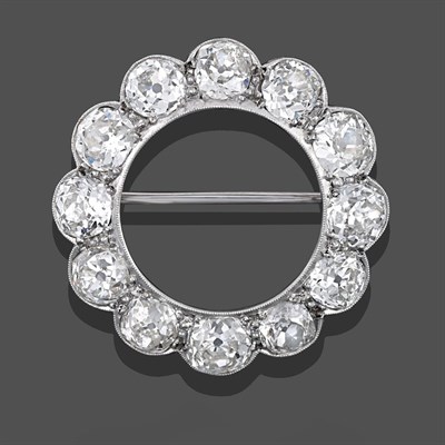 Lot 2308 - A Diamond Brooch, twelve old cut diamonds in a circular arrangement, in white millegrain...