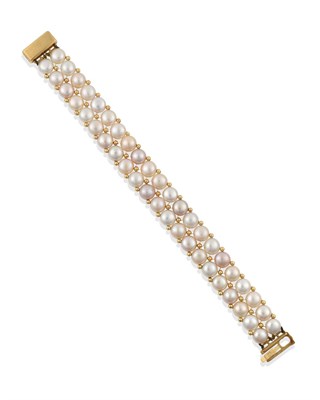 Lot 2316 - An 18 Carat Gold Two Row Cultured Pearl Bracelet, the double row multi-coloured button pearls...