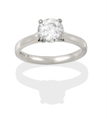 Lot 2317 - A Platinum Diamond Solitaire Ring, the round brilliant cut diamond in a four claw setting, on a...