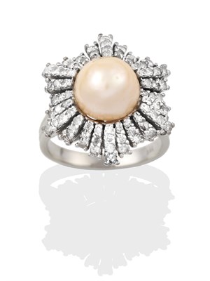 Lot 2319 - A Pearl and Diamond Cluster Ring, the central button pearl within an undulating border of eight-cut