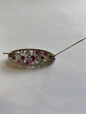 Lot 2325 - A Pink Sapphire and Diamond Brooch, circa 1925, the oval pierced plaque set throughout with...