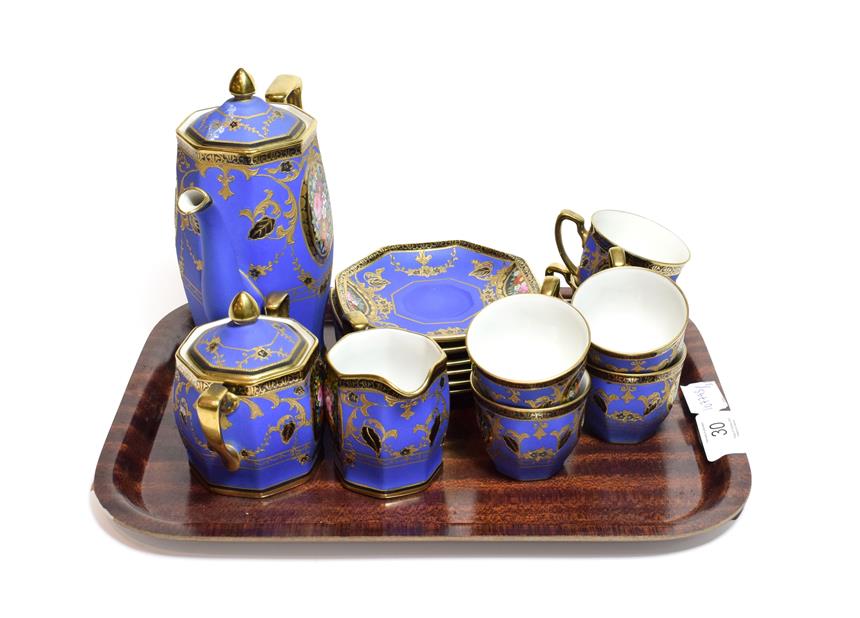 Lot 30 - A Noritake coffee set, the matte blue ground with panels of flowers and gilt decoration comprising