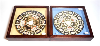 Lot 31 - A pair of Royal Crown Derby plates, in framed and glazed wall hanging display cases