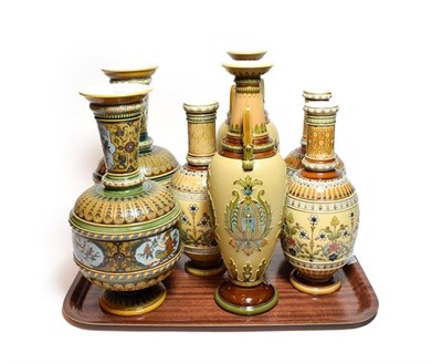 Lot 34 - Mettlach vases in the traditional style comprising three pairs and one other similar, the...