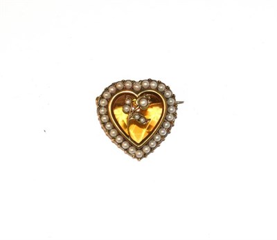 Lot 44 - A citrine and split pearl brooch, the heart shaped citrine in a yellow rubbed over setting,...
