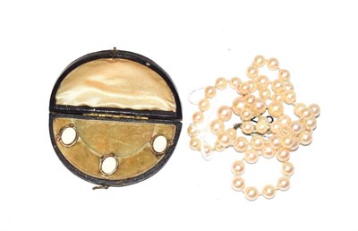 Lot 48 - Three serpent studs, cased and a single row cultured pearl necklace with diamond set clasp,...