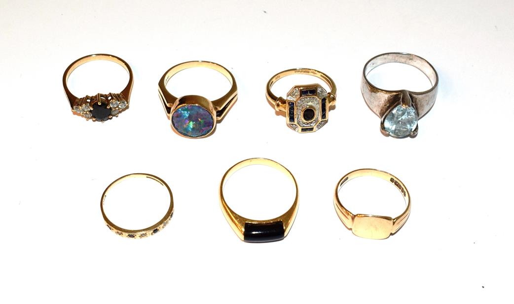 Lot 57 - A 9 carat gold signet ring, finger size N; a 9 carat gold sapphire and diamond ring, finger size L