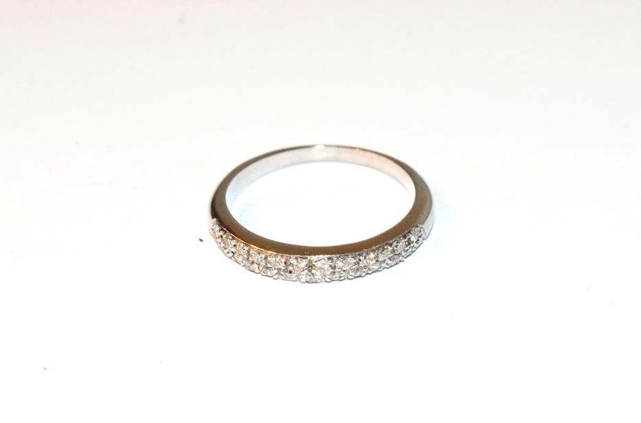 Lot 73 - A diamond half hoop ring, two rows of eight-cut diamonds in white claw settings, to a plain...