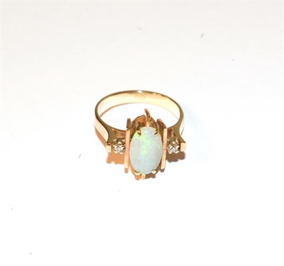 Lot 74 - An opal and diamond ring, the central oval cabochon opal flanked by yellow bars to eight-cut...
