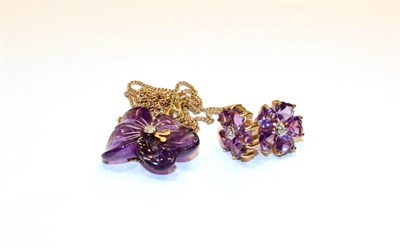 Lot 112 - A 9 carat gold carved amethyst and diamond necklace, pendant length 2.3cm, chain length 45cm...