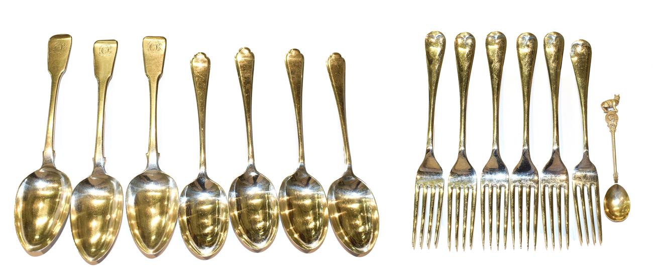 Lot 127 - Three George III silver table-spoons and four George V silver table-spoons, by Walker and Hall,...