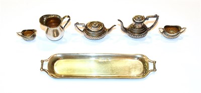 Lot 134 - A four-piece Edward VII silver miniature toy tea service, by Adie & Lovekin Ltd, Birmingham,...