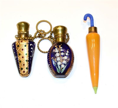 Lot 139 - Two brass mounted glass scent bottles, each blue glass body painted and gilt heightened with...