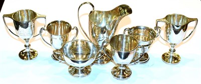 Lot 140 - A collection of six assorted two-handled cups, variously engraved, 8.5cm high and smaller...