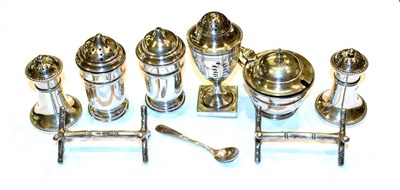 Lot 141 - A collection of assorted silver condiment items, including a George III silver pepperette, by...