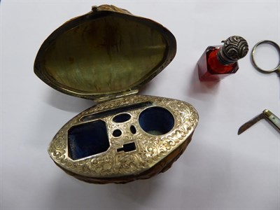 Lot 148 - A Victorian silver mounted necessaire, in carved walnut, comprising a silver mounted ruby glass...