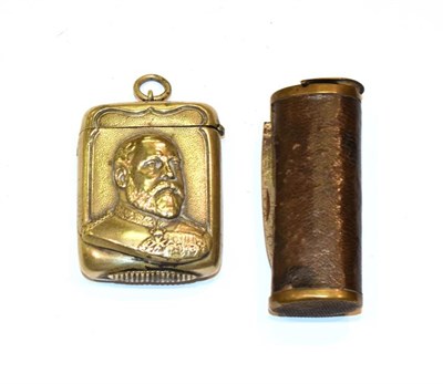 Lot 149 - A Victorian leather covered metal vesta case, compressed tubular, with hinged cover and hinged...