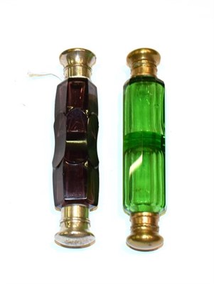 Lot 161 - Two double-ended glass scent-bottles, one in amethyst coloured glass, with a silvered screw...
