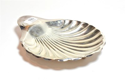 Lot 193 - An Edward VII silver shell shaped dish, by Henry Atkin, Sheffield, 1908, on three ball feet...