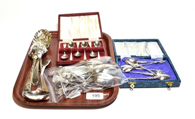 Lot 195 - A collection of silver flatware, including two pairs of George II or George III silver table...