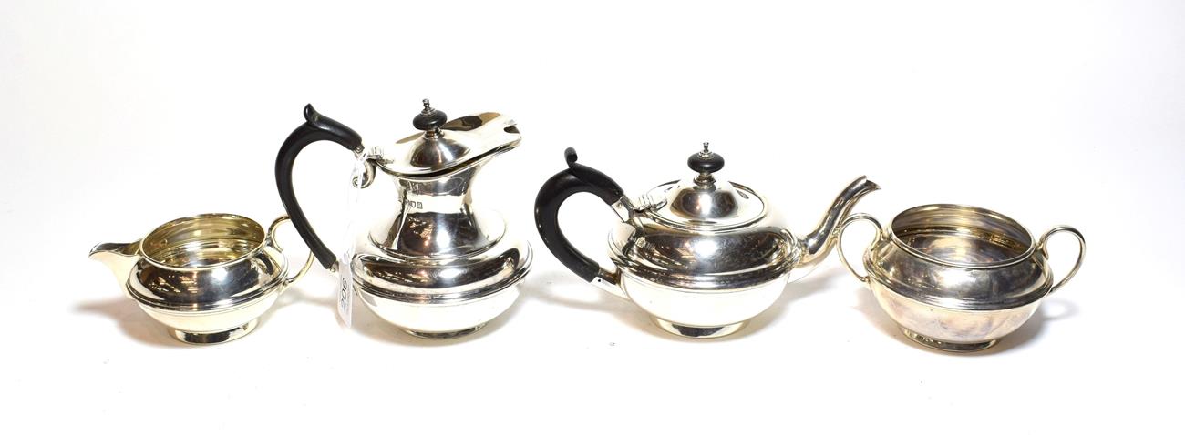 Lot 206 - A four-piece Edward VII and George V silver tea-service by Carrington and Co., London, the...