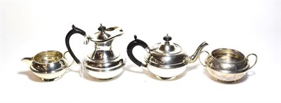 Lot 206 - A four-piece Edward VII and George V silver tea-service by Carrington and Co., London, the...