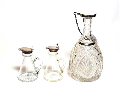 Lot 207 - A George V silver mounted cut glass decanter, the silver mounts by Mappin and Webb, Birmingham,...
