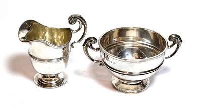 Lot 213 - An Edward VII silver cream jug and sugar-bowl, the first by Jackson and Fullerton, London,...