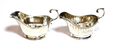 Lot 214 - A pair of George V silver sauce boats, by James R. Ogden and Sons Ltd., Birmingham, 1934, each...