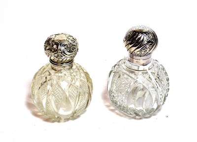 Lot 217 - Two silver mounted cut glass scent bottles, the cut-glass bottles each globular, the silver...