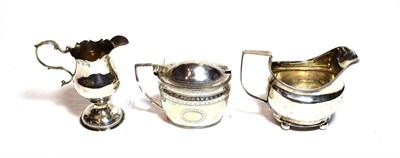 Lot 220 - Three George III silver items, comprising a mustard-pot, marked rubbed, circa 1810, with blue glass