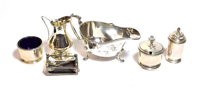 Lot 225 - A collection of assorted silver, including: a sauce boat, a cream jug, a match-box holder and a...
