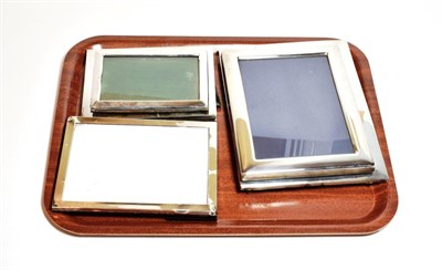 Lot 247 - A collection of Five George V and Later and American silver photograph frames, each plain...