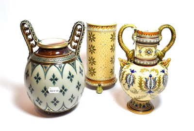 Lot 293 - Mettlach, to include two twin handled vases with floral decoration and another cylindrical...